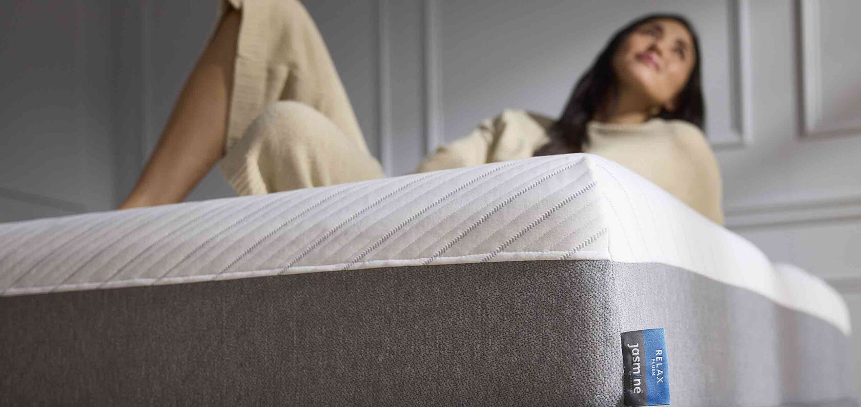 Woman on top of Jasmine mattress