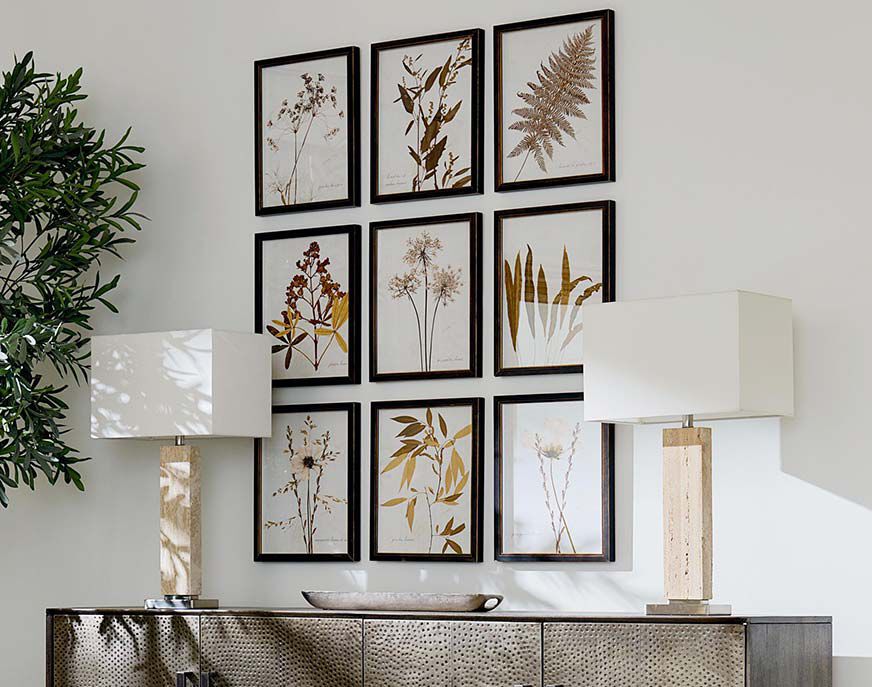 Wall art and lamps on credenza