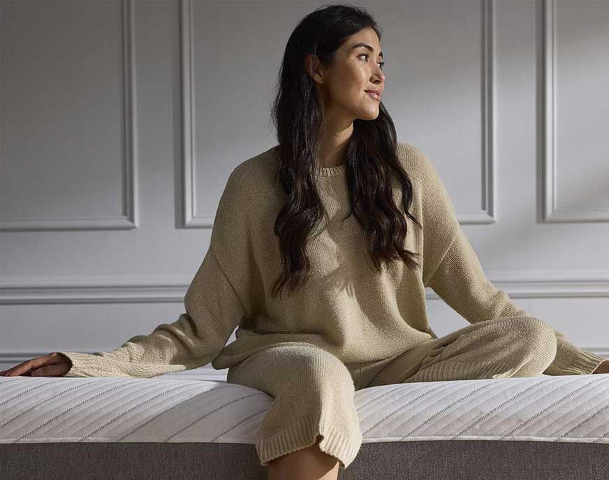 Woman sitting on Jasmine mattress